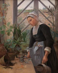 Jeune Bretonne soignant des plantes dans la serre